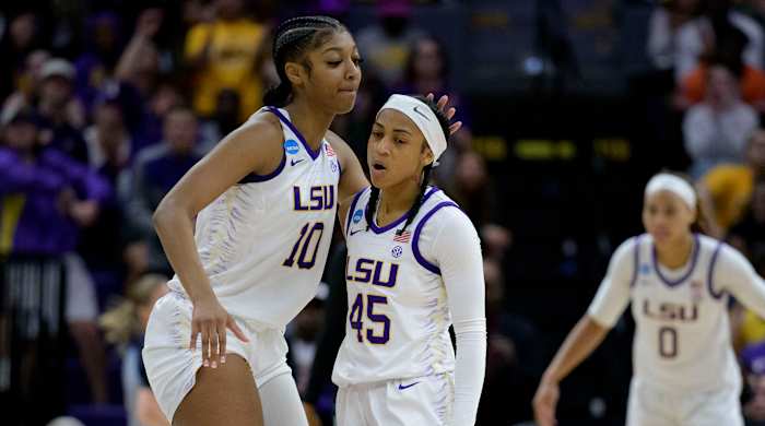 LSU forward Angel Reese celebrates with guard Alexis Morris.
